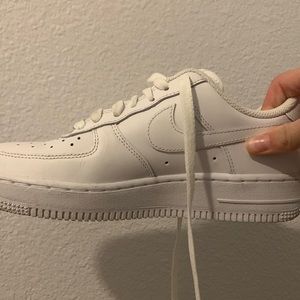 Woman’s white Nike air force 1’s